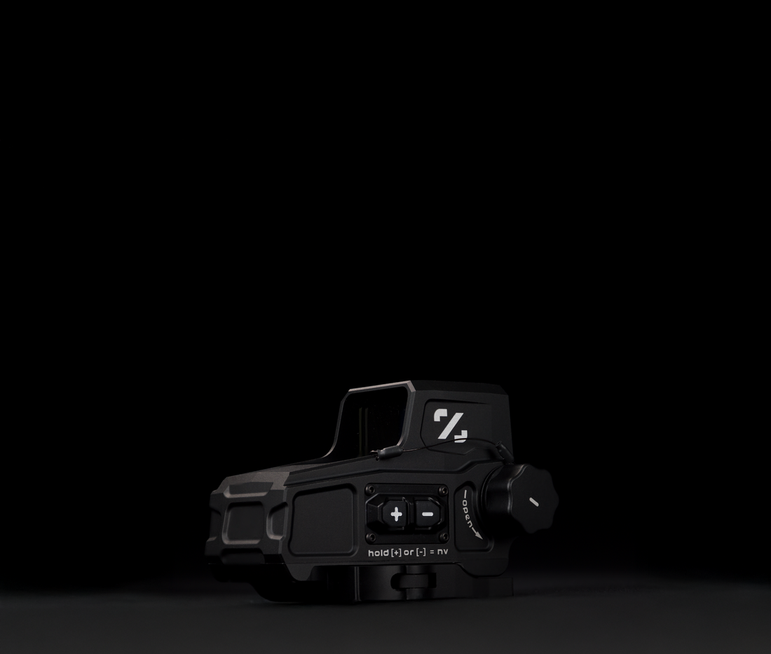 Black tactical device with visible branding on a black background
